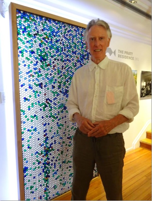 Peter Pratt in front of the mural designed by Ned Pratt and Ron Thom made from paper, coloured dyes and fibreglass. Eve Lazarus photo, 2015